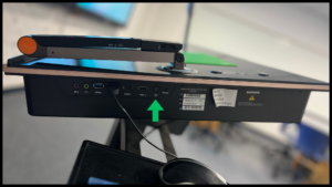 Photo of the buttons located on the right side of the podium. The power button is the furthest from where the presenter would stand.